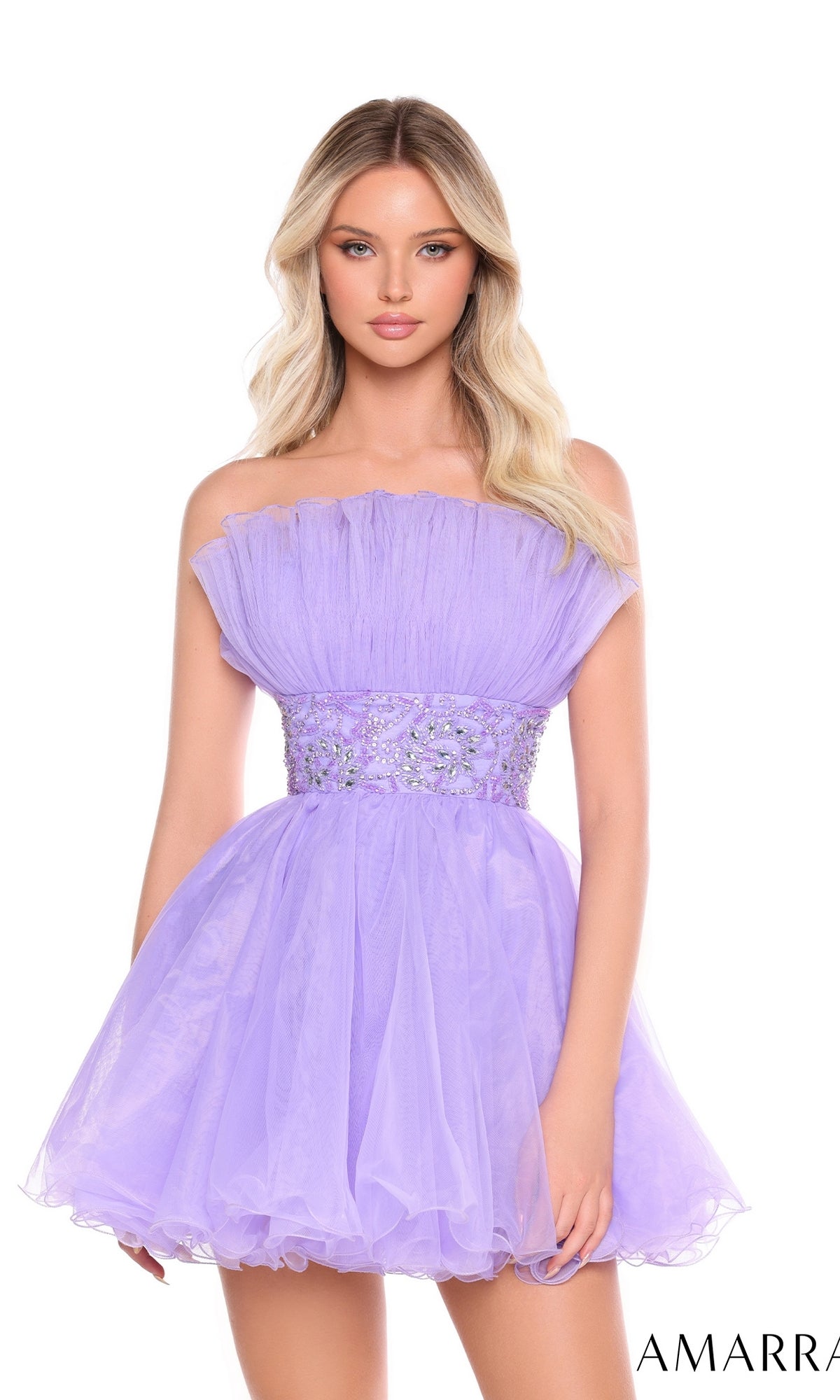 A woman stands against a white background in the Short Homecoming Dress 88038 by Amarra—a strapless, short lavender tulle dress featuring a ruffled bodice and beaded waist.